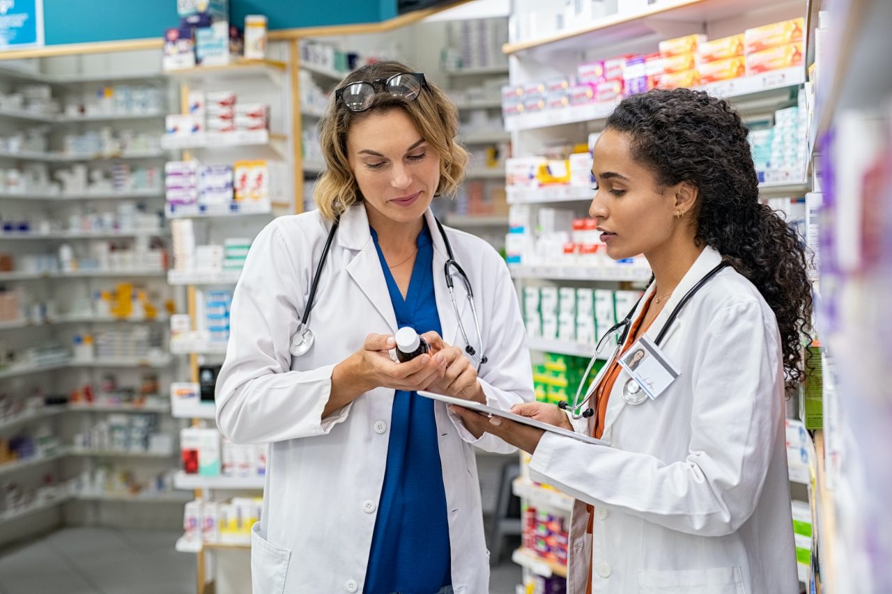 two pharmacists working together at pharmacy